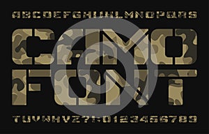 Camo alphabet typescript. Stencil uppercase letters and numbers on a dark background. photo