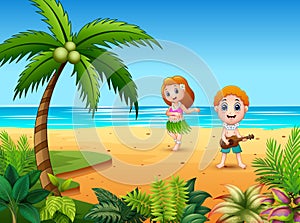 Boy playing guitar and hawaiian girl hula dancing at the seaside