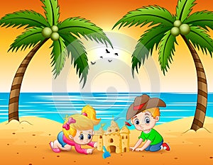 Little boy and girl cartoon making sandcastle at the beach