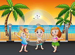 Boy playing guitar and hawaiian girl hula dancing at the seaside street