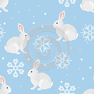 Winter seamless pattern. Cute hares and beautiful snowflakes on  blue background.