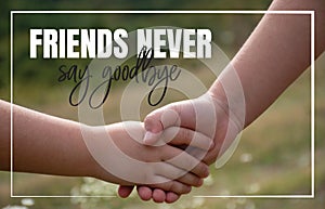 Friends never say goodbye, children hands shaking in nature, close up photography, friendship love