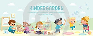 Kids play together in kinder garden. Playroom with children. photo