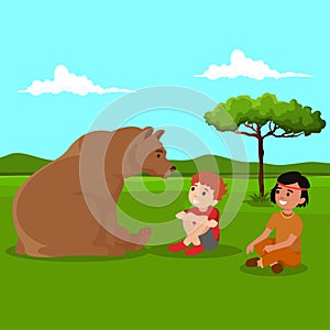 Boy playing with bear at forest