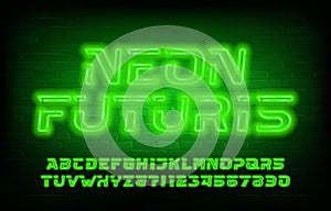 Neon Futuris alphabet font. Green neon futuristic letters and numbers. Brick wall background.