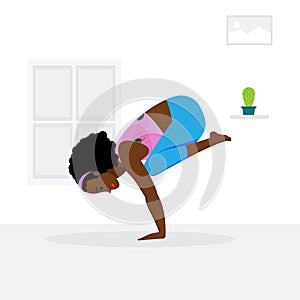 Young girl practicing crow pose yoga asana