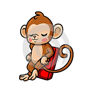 Cute baby monkey cartoon relaxing on air mattress