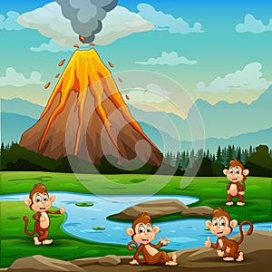 Cute of monkeys relaxing by the river with volcano erupt