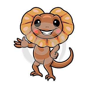 Cute little frilled lizard cartoon waving hand