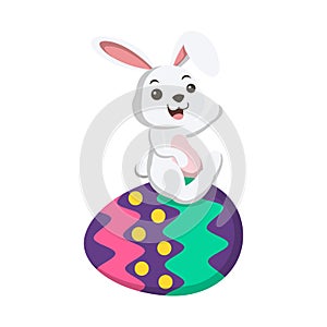 Cute little white bunny with Easter egg