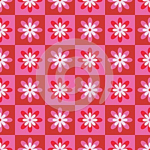 Cute retro groovy flowers on red and pink chessboard seamless pattern .