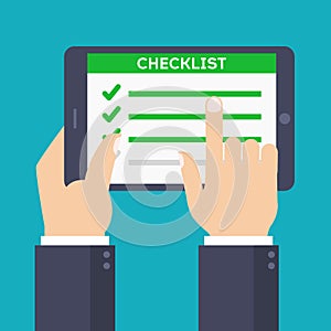 Hands holding tablet with done task list