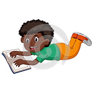 Boy lying down reading a book