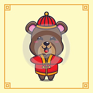 Cute bear with red chinese costum in chinese new year. photo