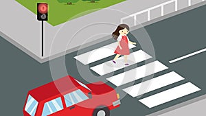 A girl crosses the road at a pedestrian crossing at a red traffic light