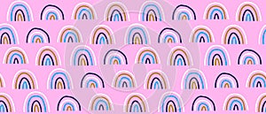 Cute Trendy Seamless Pattern with Hand Drawn Rainbows on a Light Pin Background. Girly Print.