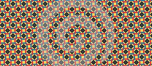 Geometric pattern featuring interlocking squares in a repeated tessellation.
