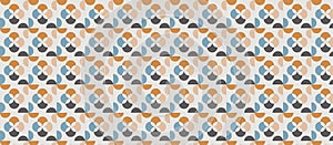 Repeating geometric pattern featuring circular and crescent shapes in a grid formation.
