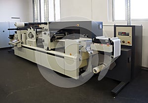 Print finishing equipment for labels