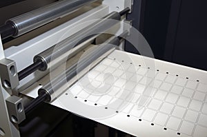 Print finishing equipment for labels