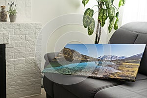 Print photography on canvas. Stretched photo canvas with gallery wrapping method, closeup, side view