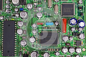 Printed circuit Board with chips and radio components electronics photo