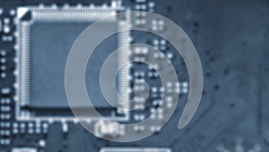 Blurred background - Printed Circuit Board with electrical components. Concept for electrical engineering and modern technology