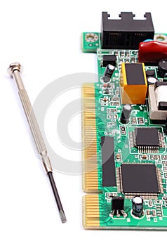 Printed circuit board and precision tools on white background, technology