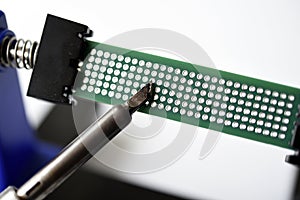 A printed circuit board for trace elements. Radio electronics. A holder for printed circuit boards