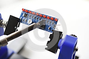 A printed circuit board for trace elements. Radio electronics. A holder for printed circuit boards