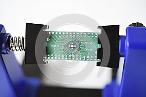 A printed circuit board for trace elements. Radio electronics. A holder for printed circuit boards