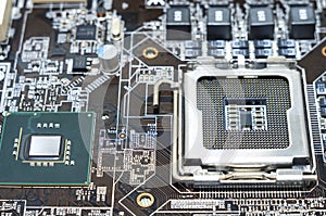 Printed computer motherboard with microcircuit, close up photo