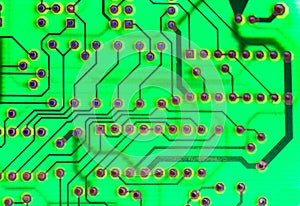 Printed green circuit board close-up. Electronic technology. Motherboard chip.