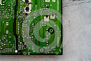 Printed green circuit board, isolated on concrete background