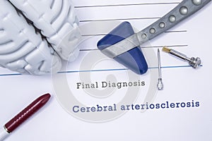 Printed medical form with diagnosis cerebral arteriosclerosis with the figure of the human brain, neurological reflex hammer, neur photo