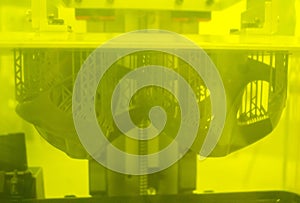 Printed models on 3D printer close-up. Objects printed on photopolymer sla