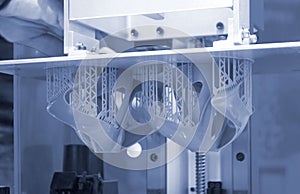 Printed models on 3D printer close-up. Objects printed on photopolymer sla