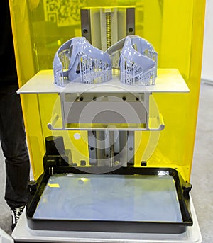 Printed models on 3D printer close-up. Objects printed on photopolymer sla