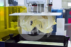 Printed models on 3D printer close-up. Objects printed on photopolymer sla 3D