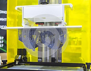 Printed models on 3D printer close-up. Objects printed on photopolymer sla