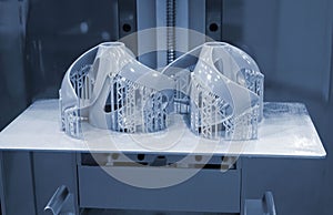 Printed models on 3D printer close-up. Objects printed on photopolymer sla