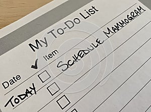 Printed to-do list with checkboxes and single task - schedule mammogram
