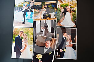 printed wedding photos on a black background.