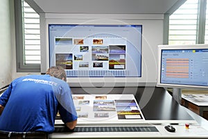 Printer checking a print run at table