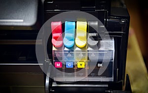 Printer ink tank for refill at office - Close up printer cartridge inkjet of color black CMYK