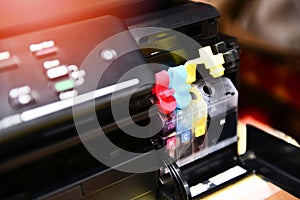 Printer ink tank for refill at office / Close up printer cartridge inkjet of color black CMYK and repair fix the problem concept