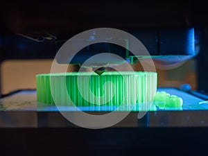 Printer printing a green 3d object