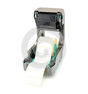 Printer with ribbon and white label roll isolated on white background with shadow reflection. White reel of labels and printer.