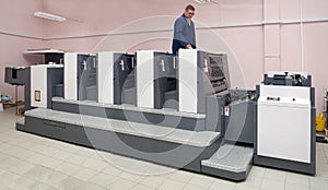 Printer working at four-section offset machine