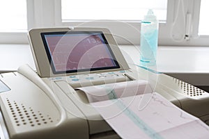 Printing of cardiogram report coming out from Electrocardiograph in labour ward photo
